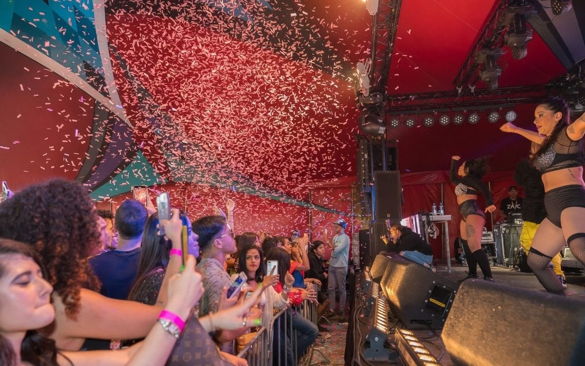 Stilo Latino Festival stage with confetti and crowd